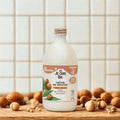 bouteille de creme de douche a l'huille de macadamia, flacon en verre renforcé réutilisable